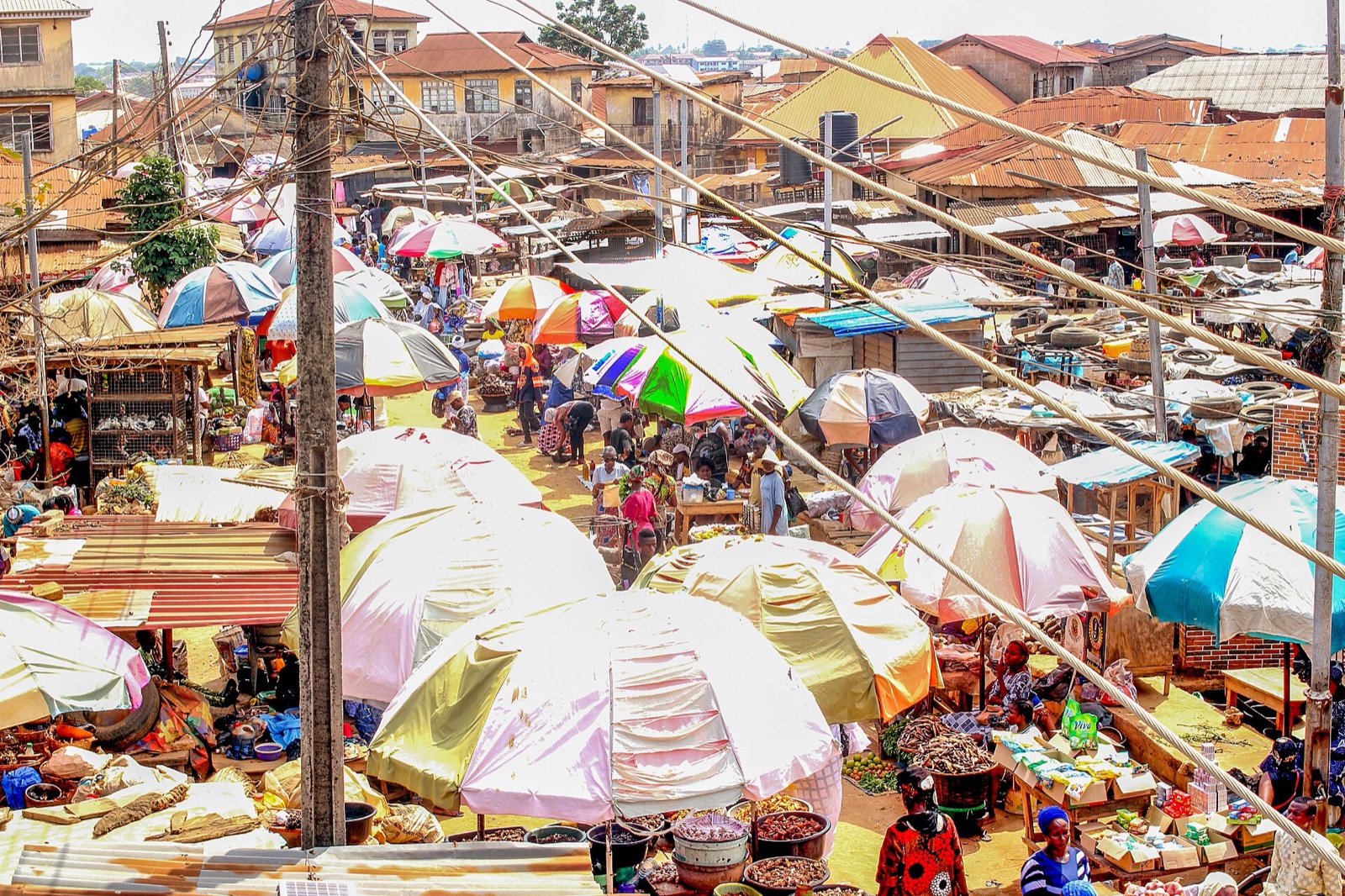 Traders and shoppers among stalls on Iworo market day in Ikorodu, Lagos